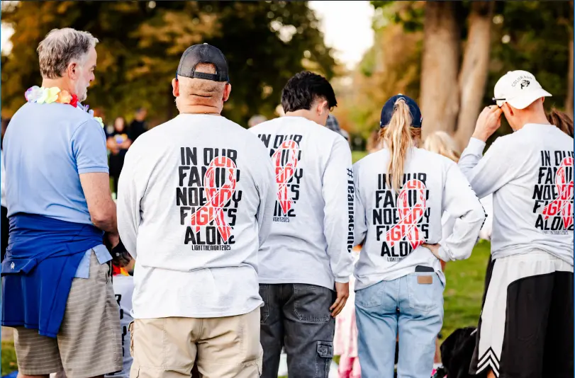 ACME Distribution team members wearing matching shirts at the Light the Night charity walk, representing a community-focused 3PL in Denver.