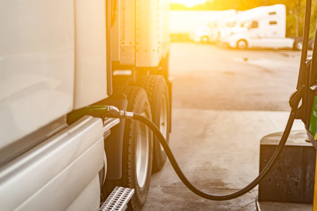 semi truck refueling diesel gas at the pump