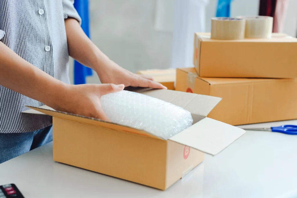 packing a box in a Denver 3PL warehouse