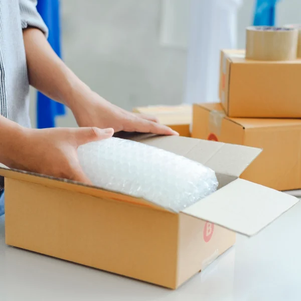 packing a box in a Denver 3PL warehouse